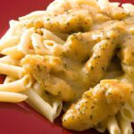 Flavorful Cajun Alfredo Pasta Topped with Crispy Chicken Delight